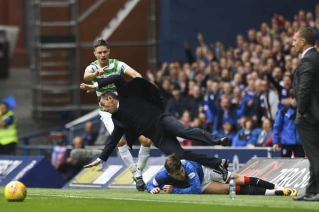 Caixinha is sent flying by Josh Windass during the last Old Firm meeting at Ibrox in September. Picture: SNS Group
