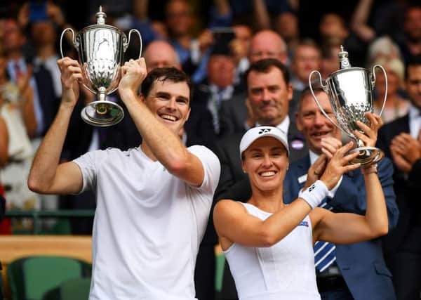 Jamie Murray and Martina Hingis celebrate with their trophies after winning the mixed doubles title at Wimbledon in July. Picture: David Ramos/Getty Images