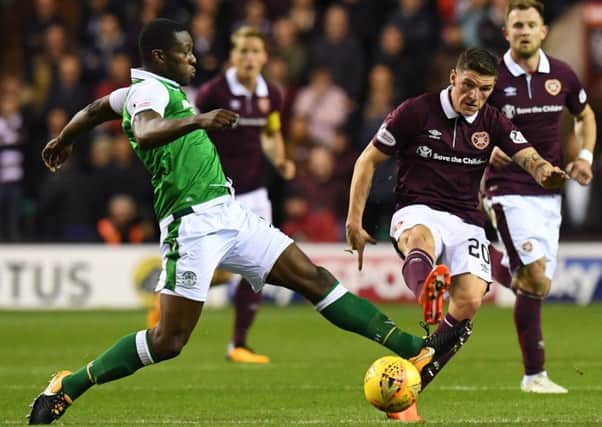 Hibs midfielder Marvin Bartley battles for the ball with Hearts' Ross Callachan. Picture: SNS