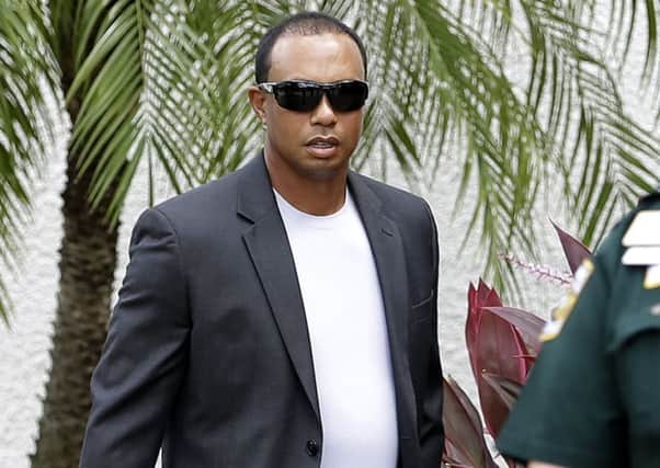 A casually dressed Tiger Woods arrives at the Palm Beach court. Picture: AP Photo/Alan Diaz