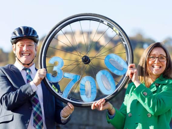 Economy secretary Keith Brown celebrates the hire scheme's 37,000 journeys with Forth Environment Link executive director Clara Walker. Picture: Forth Environment Link