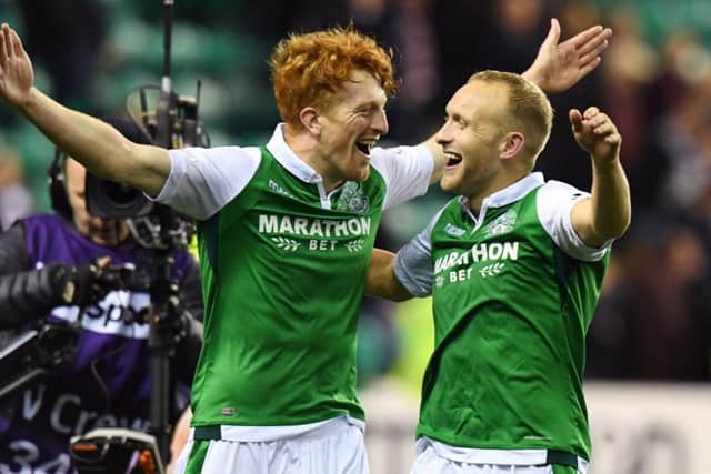 Dylan McGeouch, right,celebrates Hibs derby win over Hearts with Simon Murray. Picture: SNS.