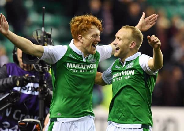 Dylan McGeouch, right,celebrates Hibs derby win over Hearts with Simon Murray. Picture: SNS.