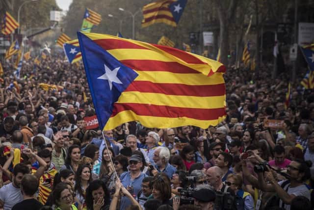 Pro-independence supports celebrate in in Barcelona after Catalonia's parliament voted to declare independence. Picture: Santi Palacios