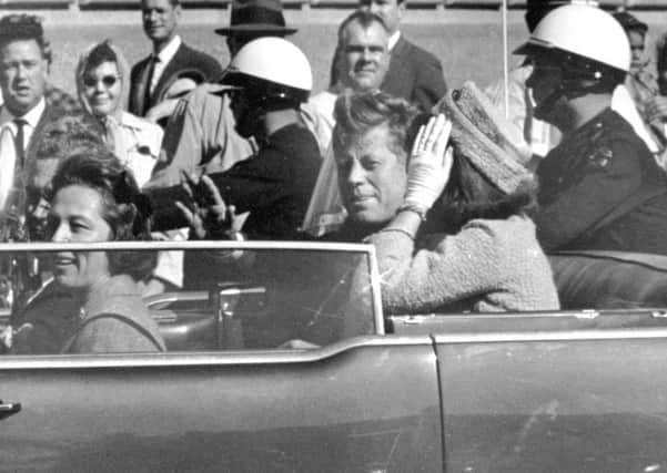 President John F Kennedy, with his wife Jacqueline, waves from his car in the Dallas motorcade moments before his assassination on 22 November, 1963. Picture: Jim Altgens/AP
