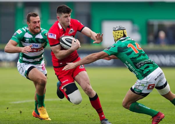 Benetton winger Angelo Esposito moves in to tackle full back Blair Kinghorn, who was involved in all three Edinburgh tries. Photograph: Roberto Bregani/Fotosport