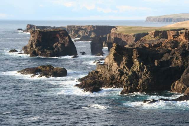 Waves crash against the Shetland cliffs. Picture: TSPL