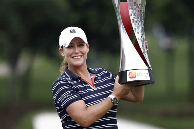 Cristie Kerr poses with the trophy after winning the Sime Darby LPGA golf tournament in Malaysia. Picture: Sadiq Asyraf/AP