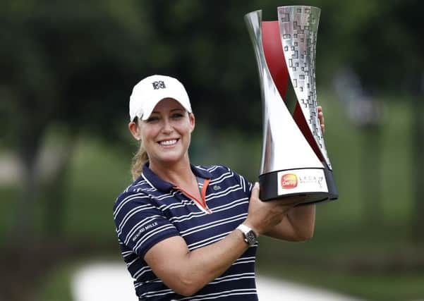 Cristie Kerr poses with the trophy after winning the Sime Darby LPGA golf tournament in Malaysia. Picture: Sadiq Asyraf/AP