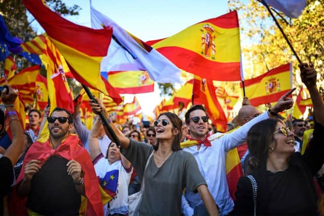Thousands of pro-unity protesters gather in Barcelona, two days after the Catalan parliament voted to split from Spain. Picture: Jeff J Mitchell/Getty