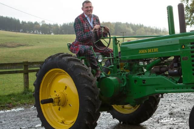 Doddie Weir with the 1947 Model A John Deere which was auctioned for the Doddie Weir MND charity.