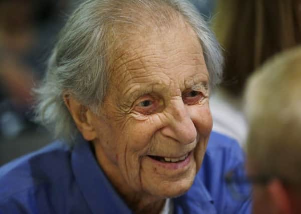 FILE - In this July 26, 2016, file photo, Fred Beckey, the legendary mountain climber, visits with guests during a promotional event for "Dirtbag: The Legend of Fred Beckey," an upcoming documentary feature film about his life in Seattle. Beckey died on Monday, Oct. 30, 2017, according to Megan Bond, a close friend who managed his affairs. He was 94. (AP Photo/Ted S. Warren, File)