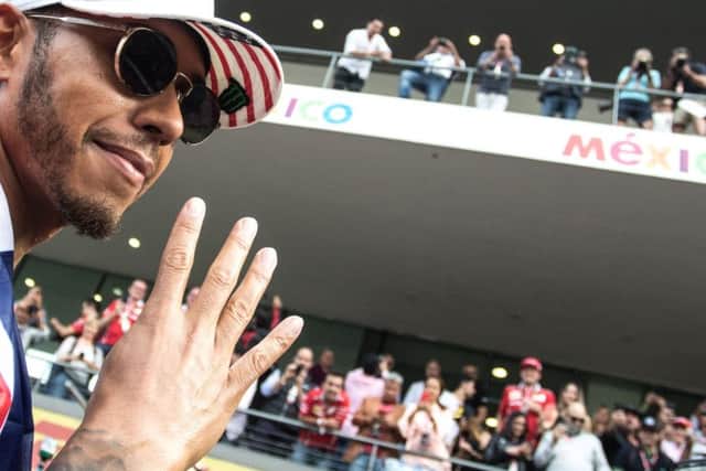 Lewis Hamilton celebrates winning his fourth world drivers' championship at the Mexican Grand Prix.
