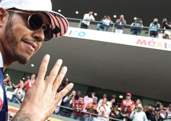 Lewis Hamilton celebrates winning his fourth world drivers' championship at  the Mexican Grand Prix.