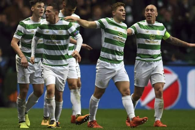 Callum McGregor, second left, celebrates with his Celtic team-mates after netting the equaliser. Picture: AP