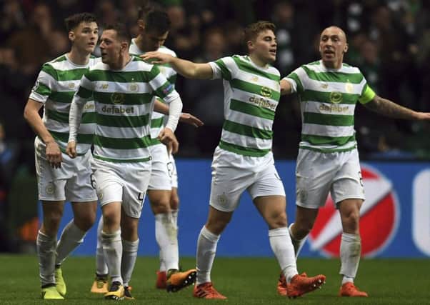 Callum McGregor, second left, celebrates with his Celtic team-mates after netting the equaliser. Picture: AP