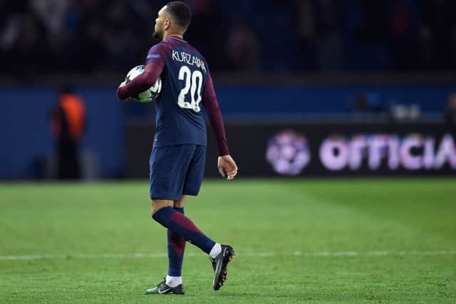 Paris Saint-Germain's French defender Layvin Kurzawa with the matchball after his hat-trick against Anderlecht. Picture: Christophe Simon/AFP/Getty Images