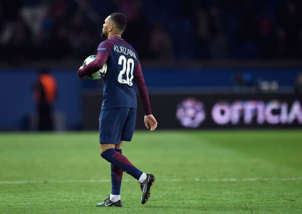 Paris Saint-Germain's French defender Layvin Kurzawa with the matchball after his hat-trick against Anderlecht. Picture: Christophe Simon/AFP/Getty Images
