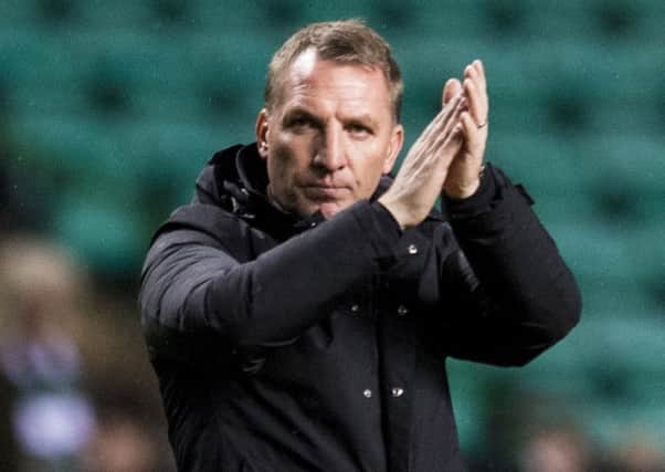 Manager Brendan Rodgers salutes the fans  after Celtic's 2-1 defeat by Bayern Munich.