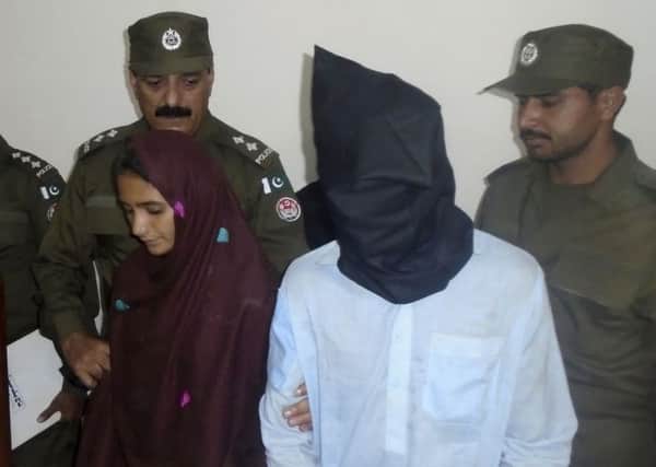 Pakistani police arrested Bibi, a newly married woman, who was married against her will in September, on murder charges after she allegedly poisoned her husband's milk and it inadvertently killed 17 other people in a remote village. Picture: AP Photo/Iram Asim