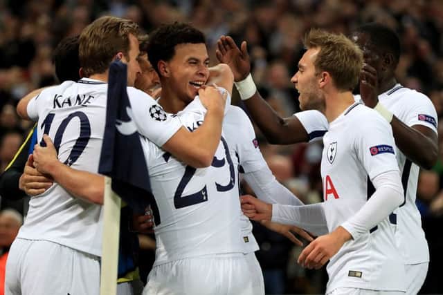 Tottenham Hotspur's Dele Alli (centre) celebrates scoring his side's second goal against Real Madrid. Picture: Mike Egerton/PA Wire