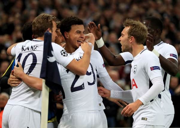 Tottenham Hotspur's Dele Alli (centre) celebrates scoring his side's second goal against Real Madrid. Picture: Mike Egerton/PA Wire