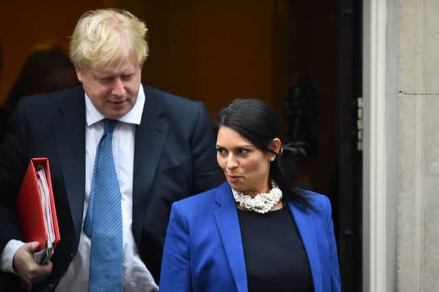 Boris Johnson and Priti Patel have faced calls to resign. Picture: AFP/Getty Images