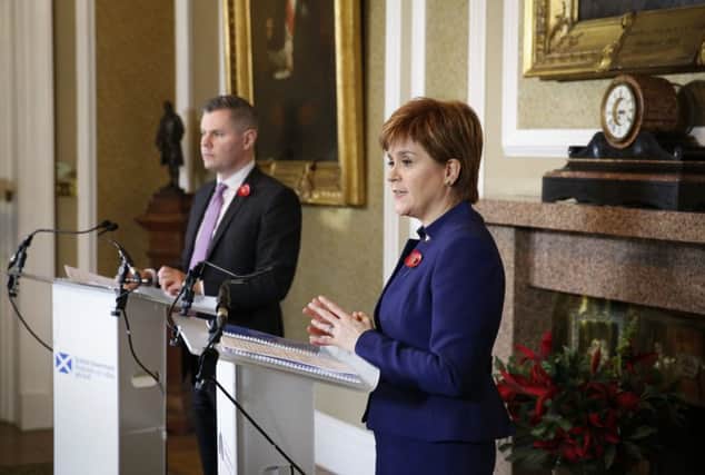Nicola Sturgeon and Derek Mackay
 hold a press conference on income tax. Picture: PA
