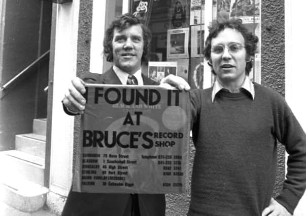 Owners Bruce Findlay and Brian Findlay with the distinctive red carrier bag 'I Found It At Bruce's' outside Bruces record shop in Rose Street Edinburgh  in November 1972. Picture: TSPL