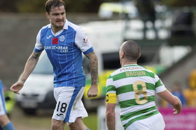 St Johnstone's Paul Paton (left) exchanges words with Celtic's Scott Brown. Picture: SNS/Craig Foy