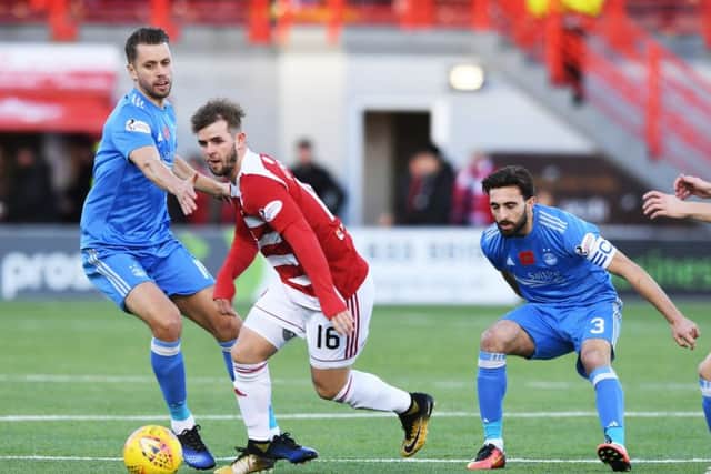 Hamilton's David Templeton evades Aberdeen's Kari Arnason, Graeme Shinnie and Ryan Christie. Picture: SNS/Gary Hutchison