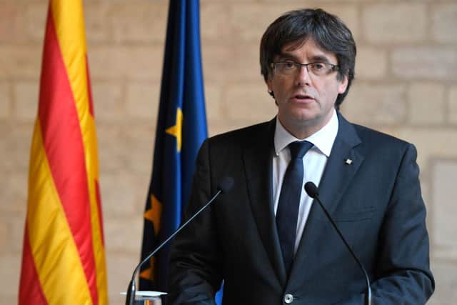 Carles Puigdemont and four former advisers turned themselves in to Belgian authorities. Picture: AFP/Getty