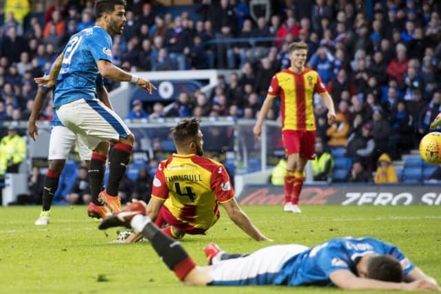 Rangers Daniel Candeias, left, scores to make it 2-0 as the Ibrox men cruised to a comfortable victory over city rivals Partick Thistle.  Picture: Rob Casey/SNS