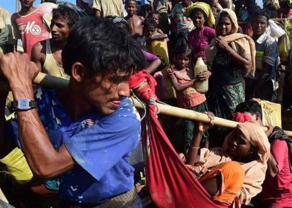 Refugees fleeing the ethnic violence in Myanmar