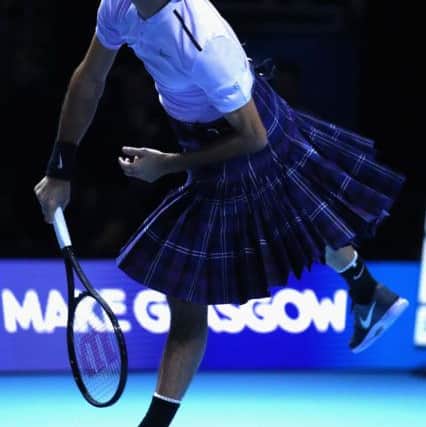 Roger Federer plays a shot whilst wearing a kilt during his match against Andy Murray during Andy Murray Live at The Hydro in Glasgow tonight. Photo: Clive Brunskill/Getty Images.