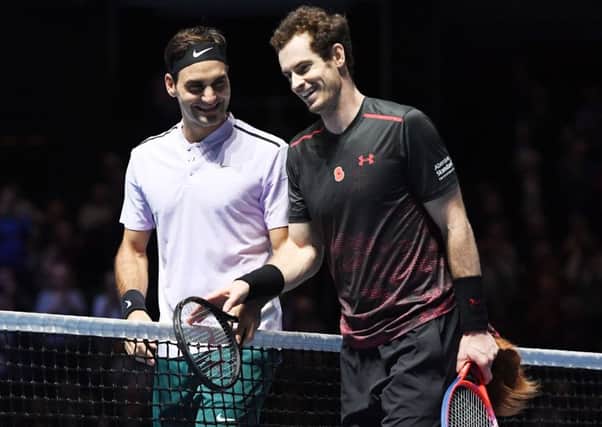 Andy Murray and Roger Federer share a joke after their exhibition match at the 'Andy Murray Live' event in Glasgow. Federer beat Murray 3-6, 6-3 (5-10). Picture: SNS