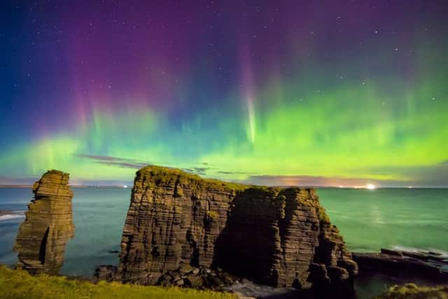 Amazing northern lights display over the Sea Stacks at Noss Head, Caithness. Picture: Maciej Winiarczyk / SWNS