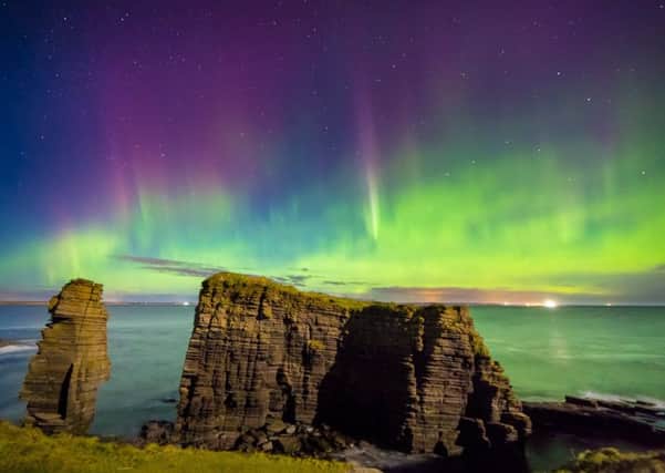 Amazing northern lights display over the Sea Stacks at Noss Head, Caithness,
