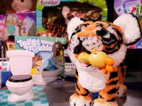 The Toilet Trouble game and Hasbros FurReal Roarin Tyler are among the twelve toys tipped to be bestsellers this Christmas.