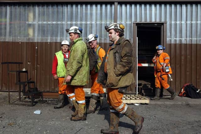 Miners clock off on the final working day at Longannet colliery in West Fife in 2002. The industry employed 82,000 in Scotland as recently as 1957. Picture: Robert Perry/TSPL