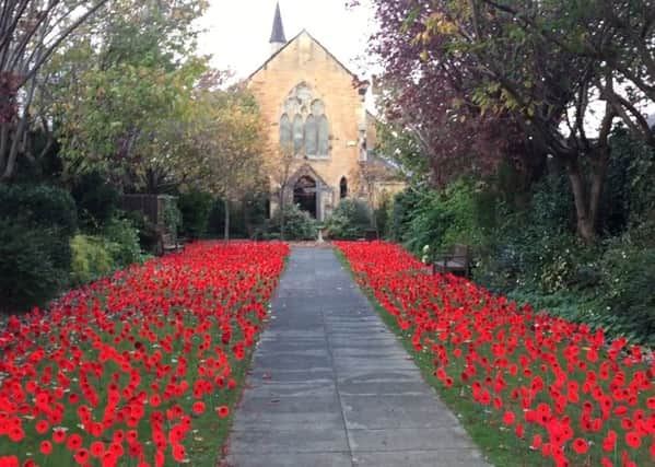 Woolen poppies planted in a special Garden of Remembrance St Andrews High Church in Musselburgh, East Lothian, to commemorate members of the Armed Forces.