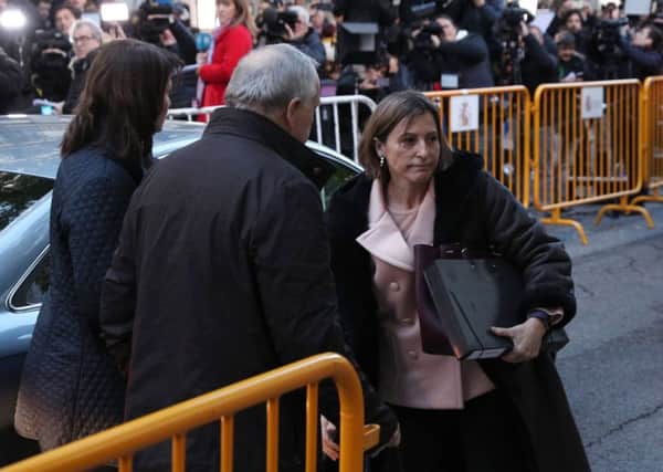 Former speaker of Catalonia's sacked parliament Carme Forcadell (right) arrives at the Supreme Court in Madrid, AFP PHOTO / STRSTR/AFP/Getty Images