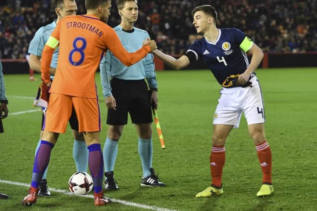 Netherlands captain Kevin Strootman (left) with Kieran Tierney, who was skippering Scotland at the age of 20. Picture: Craig Williamson/SNS
