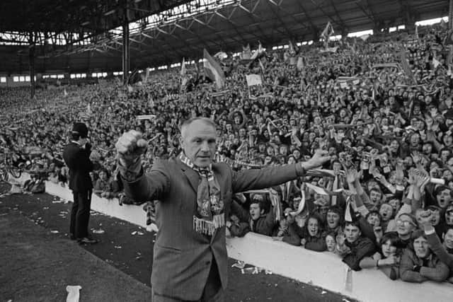 Liverpool manager Bill Shankly receives the acclaim of the Kop after Liverpool clinched the Football League Championship with a draw against Leicester City