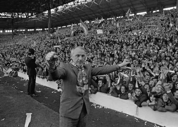 Liverpool manager Bill Shankly receives the acclaim of the Kop after Liverpool clinched the Football League Championship with a draw against Leicester City