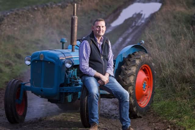 Doddie Weir pictured with his Fordson Dexta Tractor on his farm near Galashiels. Picture: Ian Rutherford
