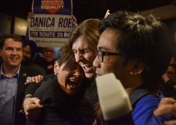 Democrat Danica Roem celebrates her victory in Virginia, becoming the first openly transgender person to be elected to a state legislature in the US. Photograph: Jahi Chikwendiu/Washington Post/AP