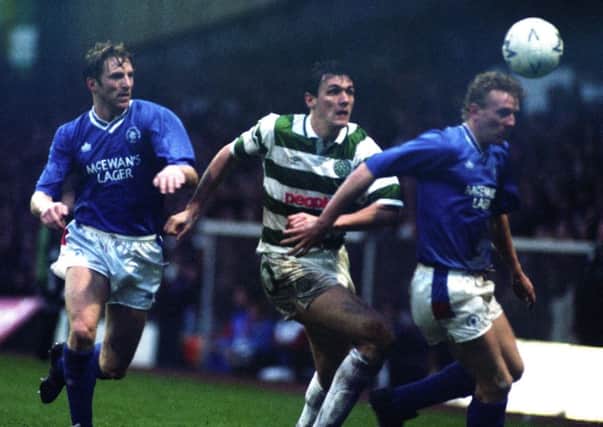 Tony Cascarino battles for the ball with Rangers defenders Gary Stevens (left) and Oleg Kuznetsov during his Celtic days. Picture: SNS
