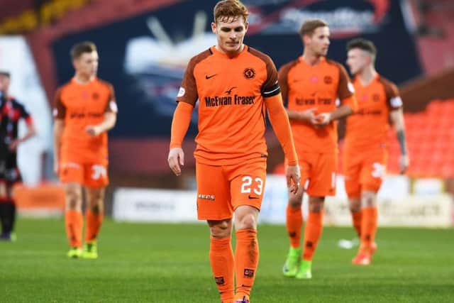 Fraser Fyvie trudges off following Dundee United's defeat to part-timers Crusaders. Picture: SNS/Craig Foy