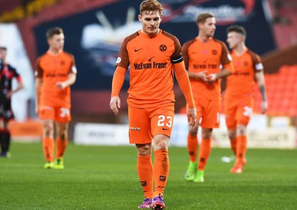 Fraser Fyvie trudges off following Dundee United's defeat to part-timers Crusaders. Picture: SNS/Craig Foy